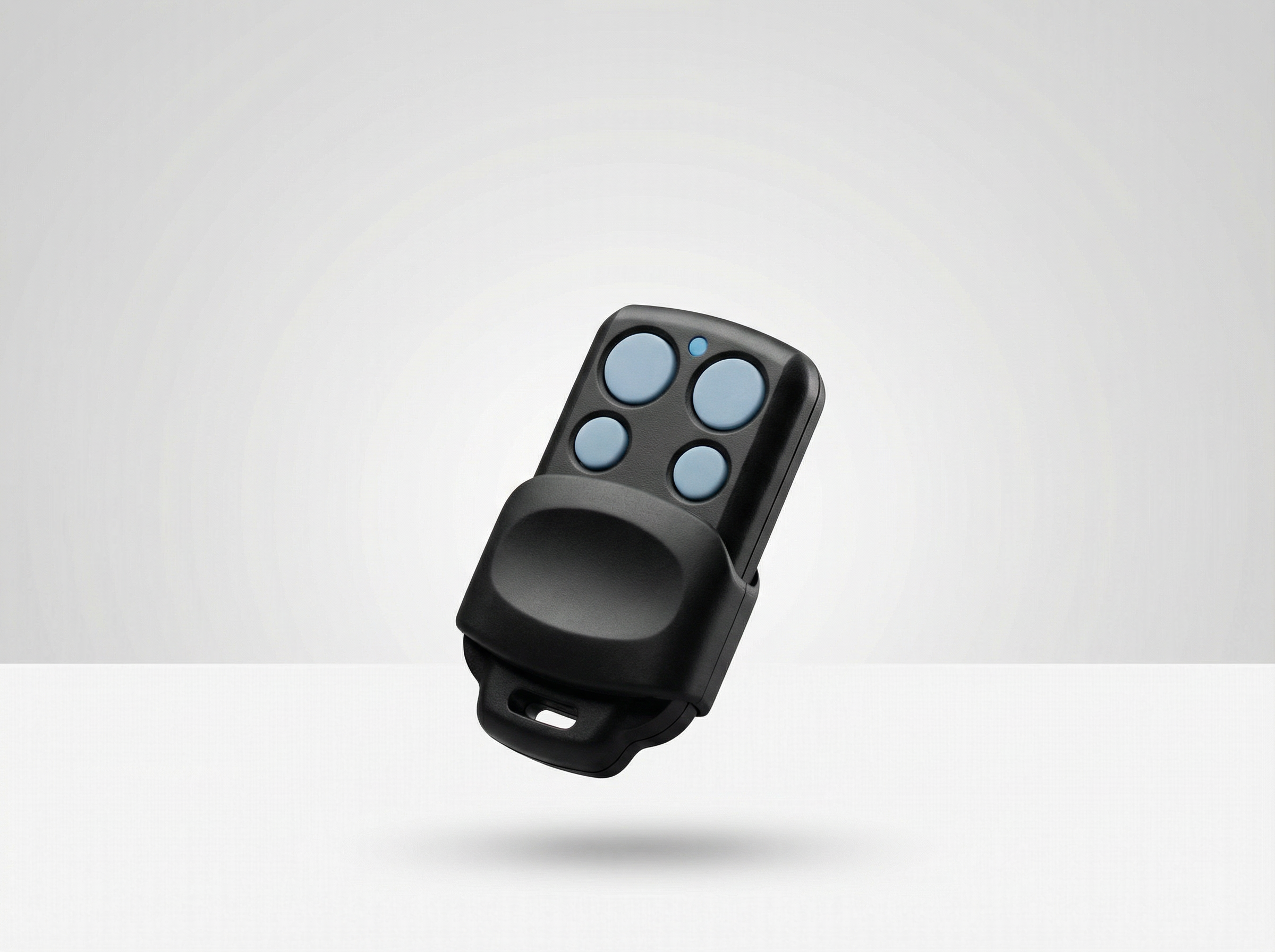 Black remote control with blue buttons on a white background