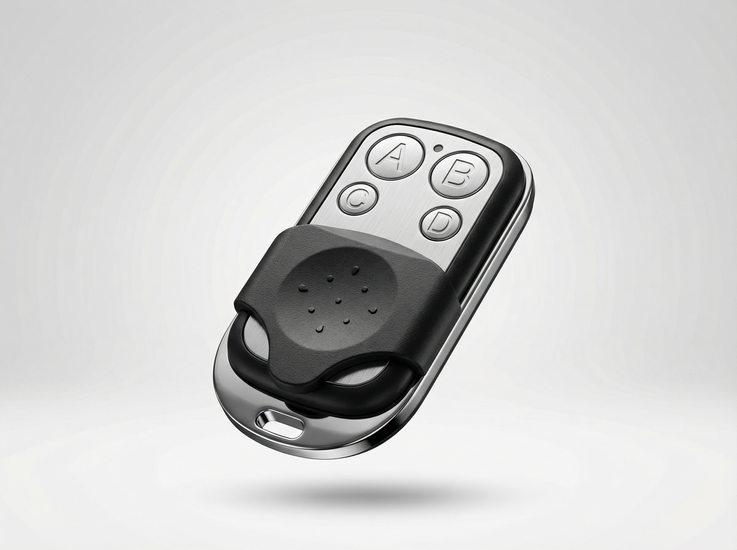 Black remote control with buttons on a light gray background