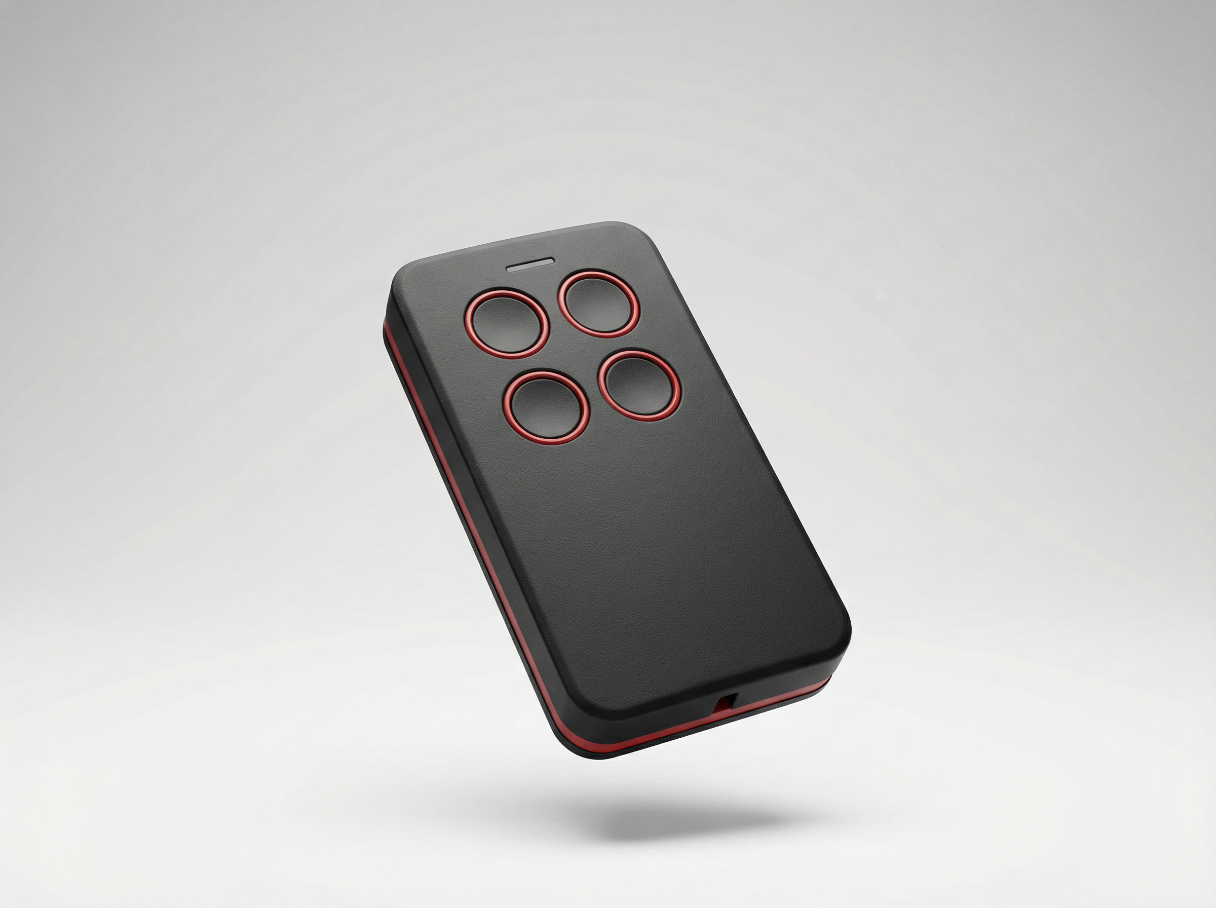 Black remote control with red buttons on a gray background
