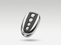 Black and silver remote control on a light gray background