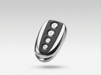 Black and silver remote control on a light gray background