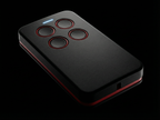 Black remote control with red accents on a black background