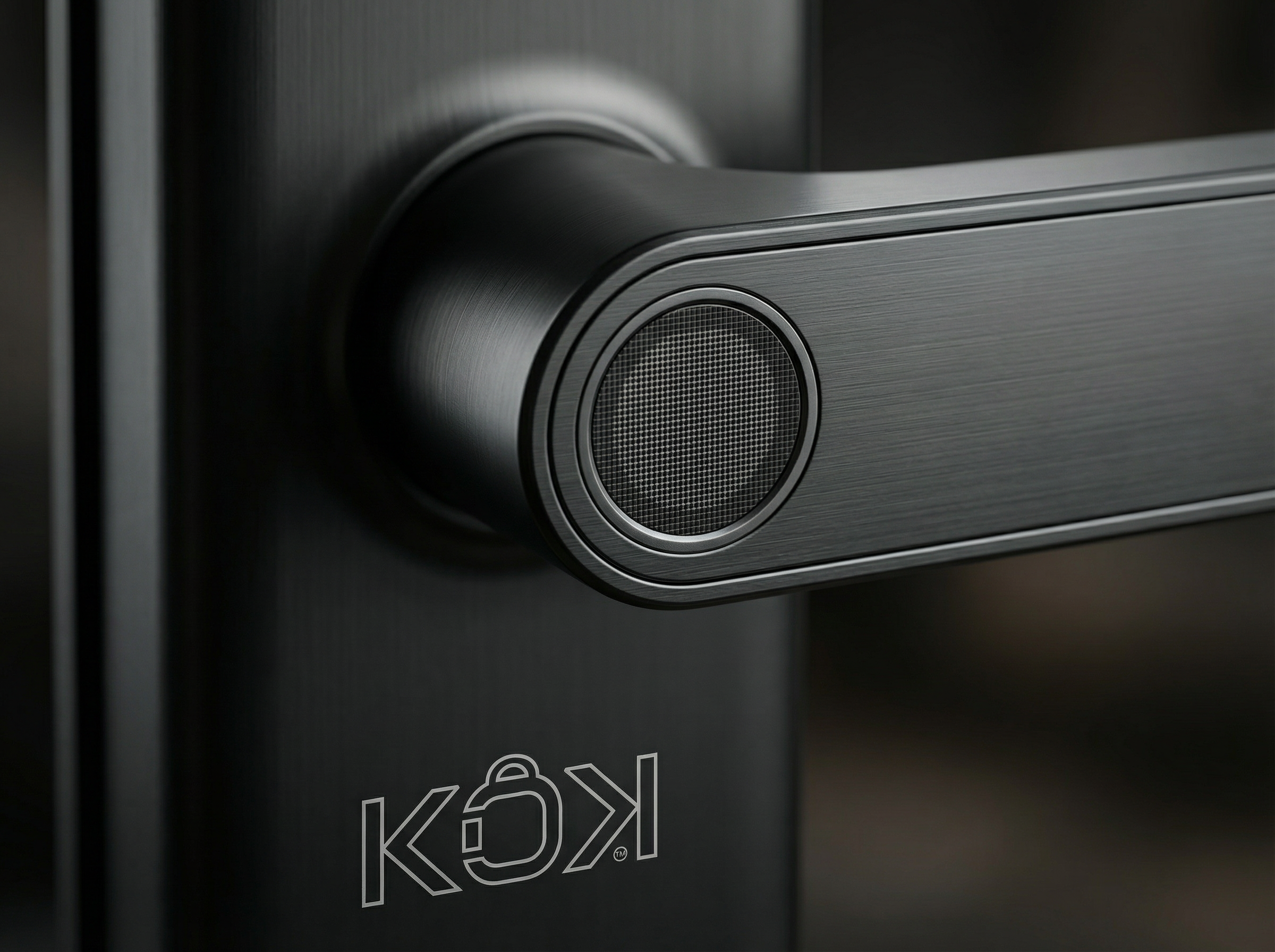 Close-up of a black door handle with a speaker on a dark background, featuring the Kwikset logo.
